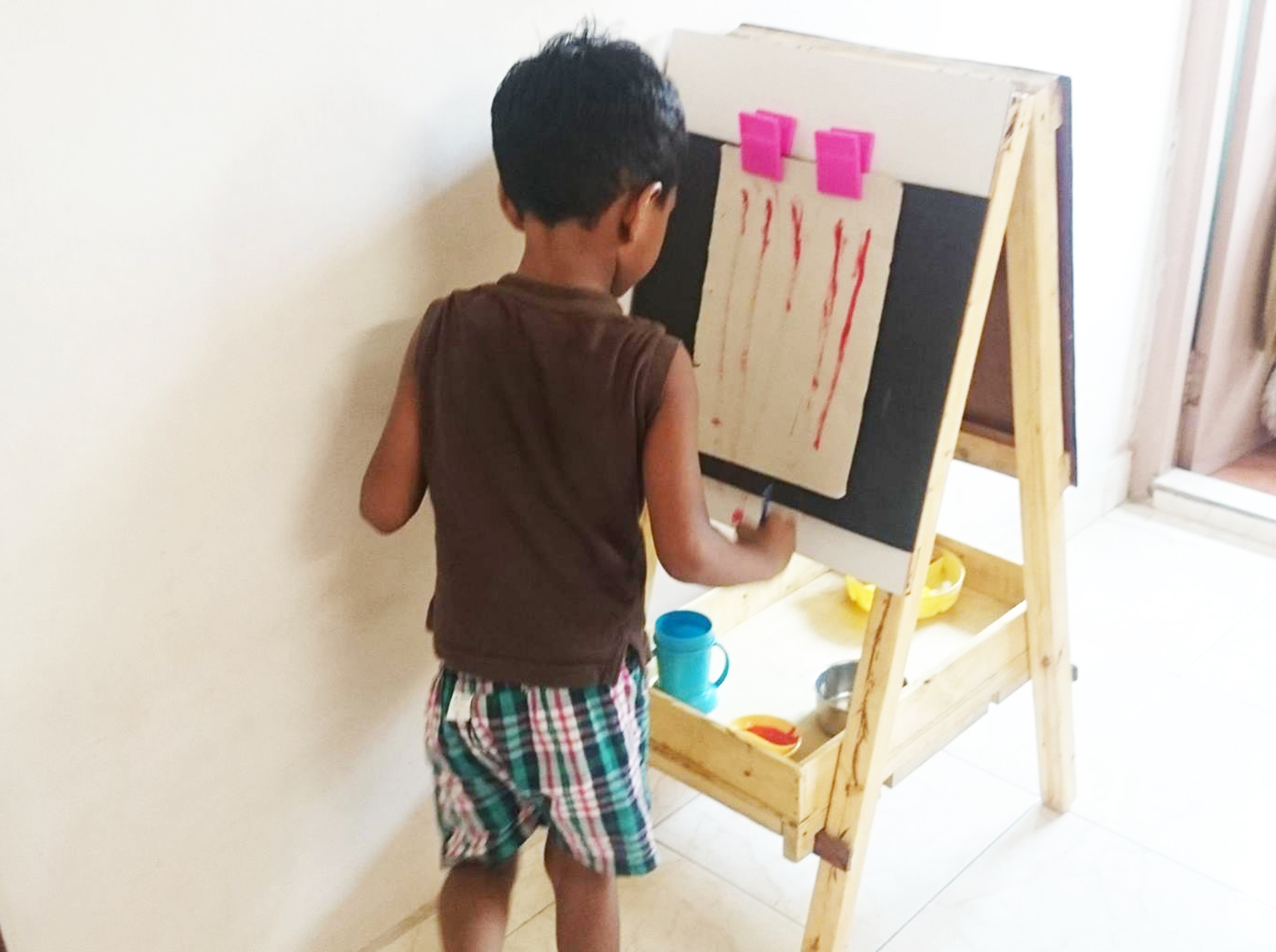 A B Cube Day Care Child who is painting 